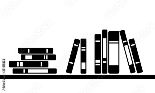 Monochrome books stand on shelf