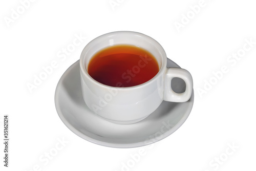 White cup with black tea on a white saucer on a dark background.