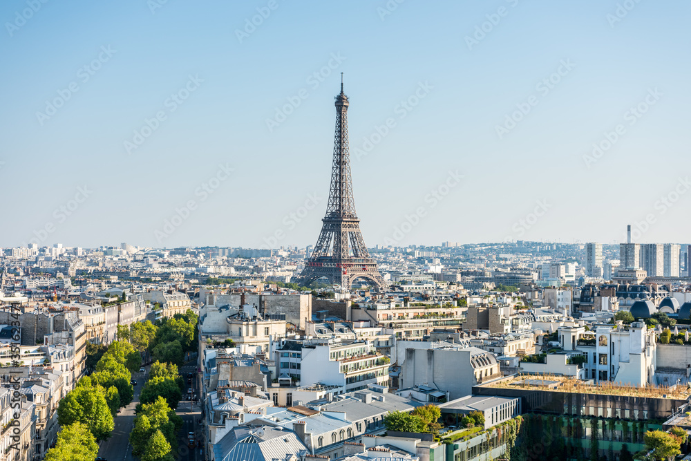 Aerial view of the old town of Paris, with the building of Eiffel tower, from the top of the Arc de Triomphe at the Champs-Elysees Avenue in Paris, France