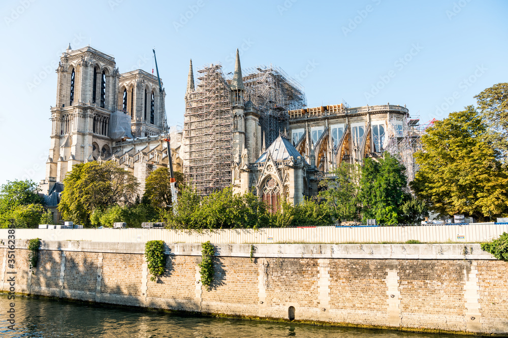 Obraz premium Reconstruction of Notre-Dame de Paris after the big fire, a medieval Catholic cathedral on the Ile de la Cite in the 4th arrondissement of Paris, France.