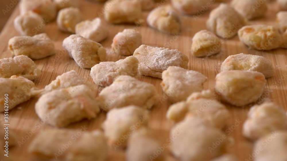 steady cam on chopping board full of handmade dumplings steady cam on chopping board full of handmade dumplings