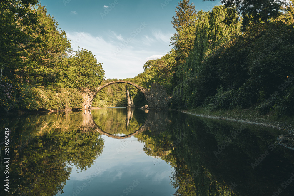 Fantastic morning scene of Azalea and Rhododendron Park Kromlau, Germany, Europe. Splendid summer view of Rakotz Bridge Rakotzbrucke, Devil's Bridge . Fantastic morning scene of Azalea and Rhododendron Park Kromlau, Germany, Europe. Splendid summer view of Rakotz Bridge Rakotzbrucke, Devil's Bridge .
