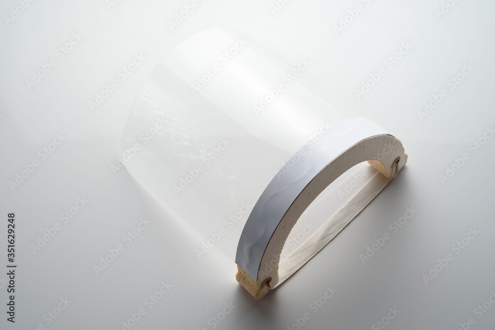 Transparent face screen, on white background. Protector to prevent contagion Transparent face screen, on white background. Protector to prevent contagion