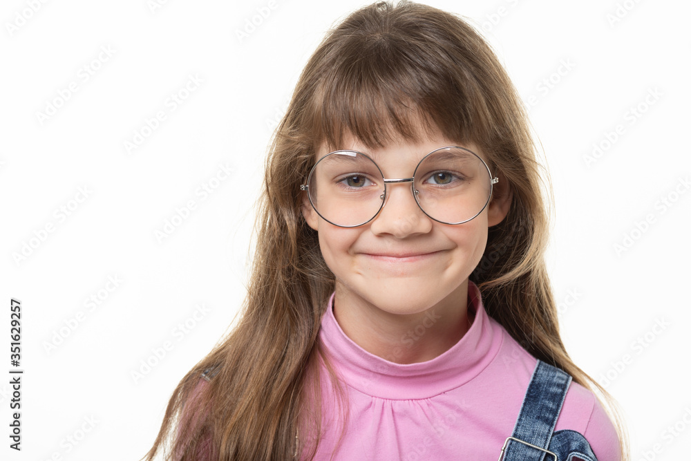 Portrait of a natural beautiful girl in glasses on a white background