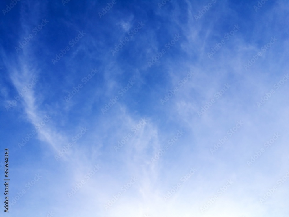 White cirrus clouds formations on blue sky, texture background White cirrus clouds formations on blue sky, texture background
