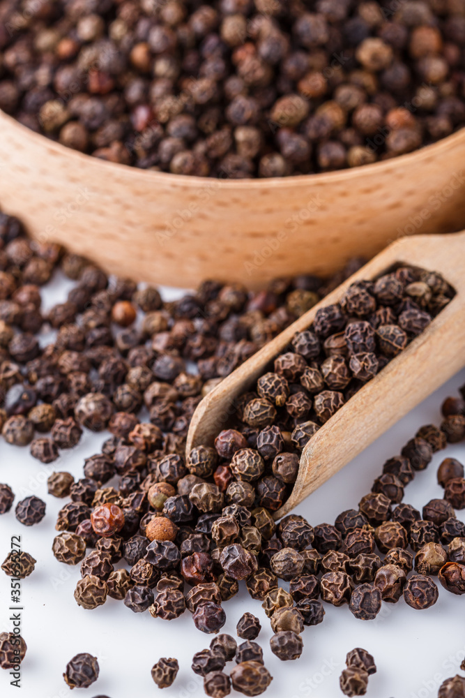 fragrant black pepper on white acrylic background fragrant black pepper on white acrylic background