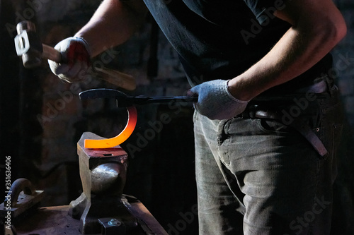 The process of forging hot steel in the forge 4