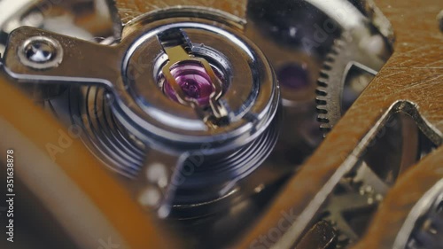 Wallpaper Mural Sliding shot over clock mechanism running gear in extreme macro 4k Torontodigital.ca