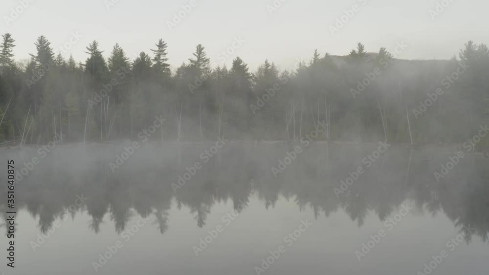 Thick mist covered lake sunrise Onawa wilderness Thick mist covered lake sunrise Onawa wilderness