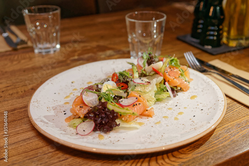 Simple salad with lettuce and salmon