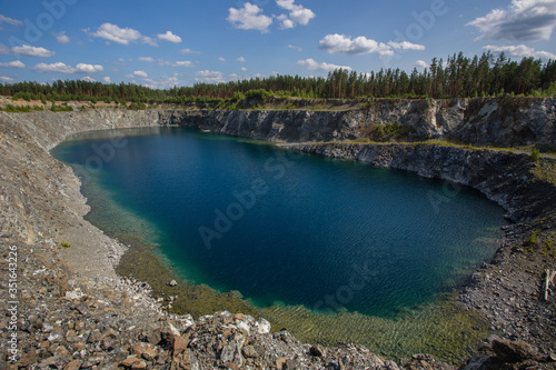 Flooded open pit chromium chrome ore quarry mine with blue waterpit chromium chrome ore quarry mine