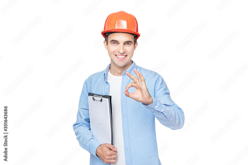 Builder smiles and shows OK gesture, isolated background, copy space Builder smiles and shows OK gesture, isolated background, copy space