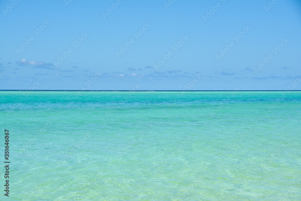 Turquoise water and blue sky. Maldives.
Tropical beach with turquoise water. For wallpaper design.
