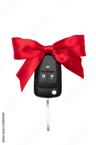 Car keys with red bow over white background. Isolate.