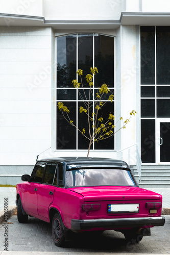 Photography vintage car in front of a house