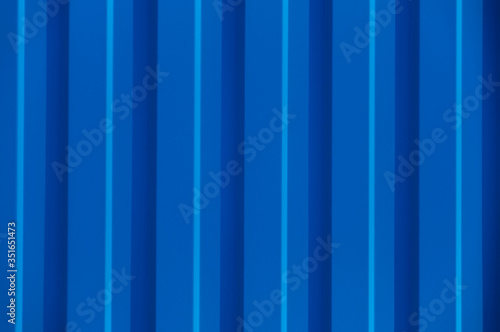 Blue corrugated metal panel texture. Copy space.