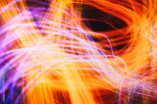Abstract light pattern. Blurred neon lights. A dynamic backdrop for your design. Bright orange © Yelyzaveta
