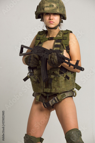 Beautiful girl in military clothes. studio shot photo