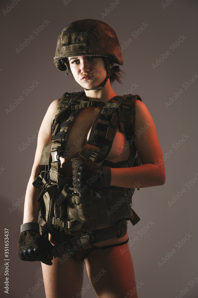 Beautiful girl in military clothes. studio shot Beautiful girl in military clothes. studio shot
