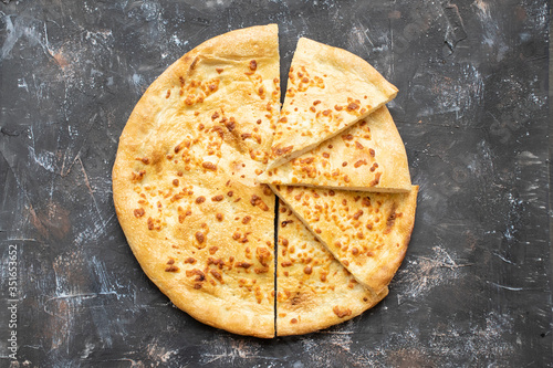 Tortilla with cheese on a dark background