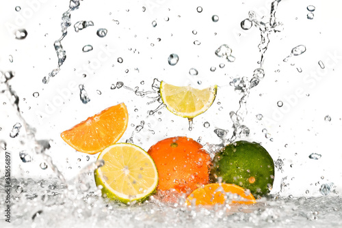 fresh orange, citrus and lemon with water splash on white background 
