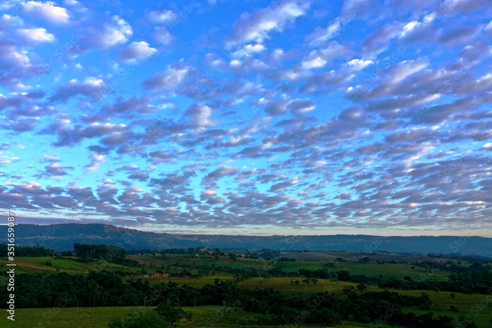 Fototapeta premium Aerial view of dramatic sky in the ranch. Rural life scene. Countryside landscape. 