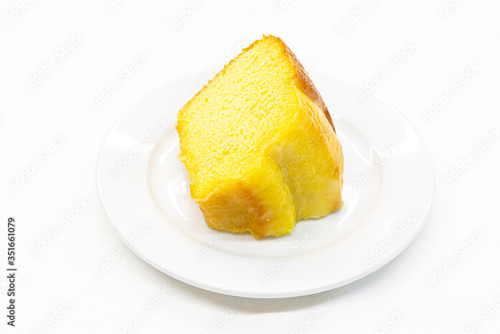 Closeup piece of sweet lemon cake served on white plate,Copy space. Closeup piece of sweet lemon cake served on white plate,Copy space.