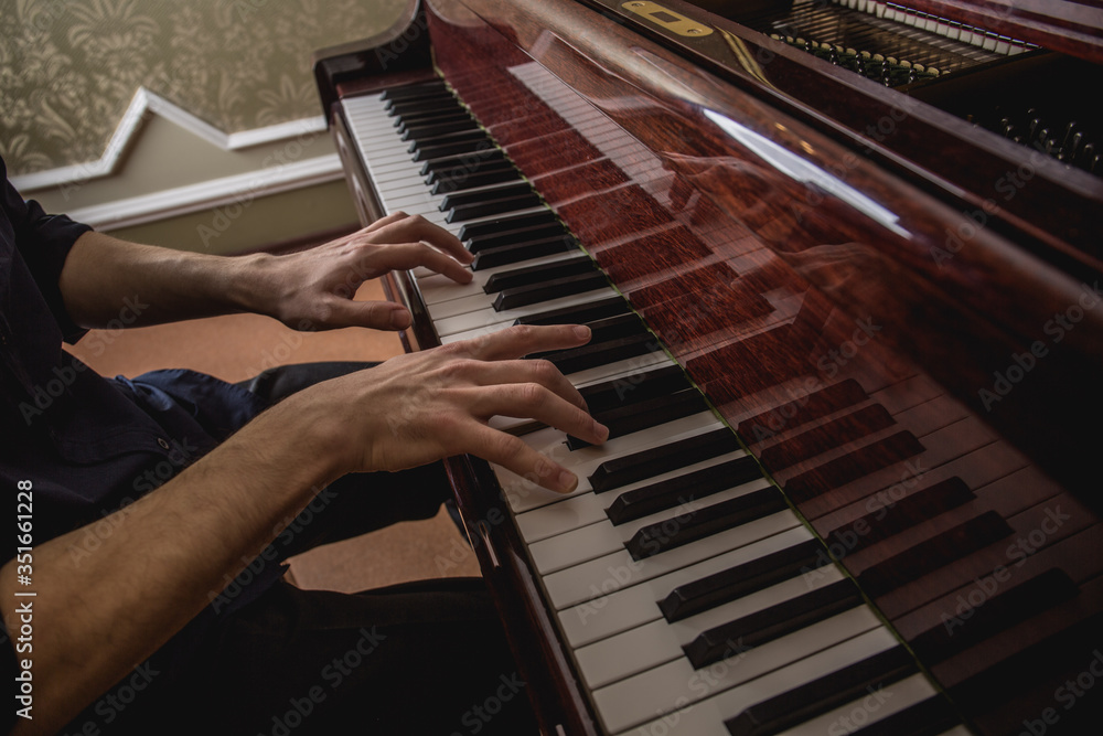 Fototapeta premium A man playing the piano