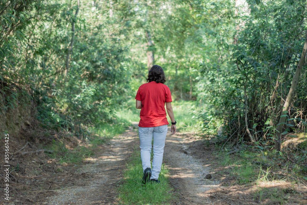 Woman strolling in lonely quiet, complete social isolation Woman strolling in lonely quiet, complete social isolation