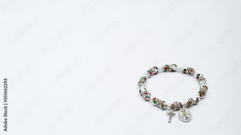 Obraz premium Catholic rosary bracelet with copy space
