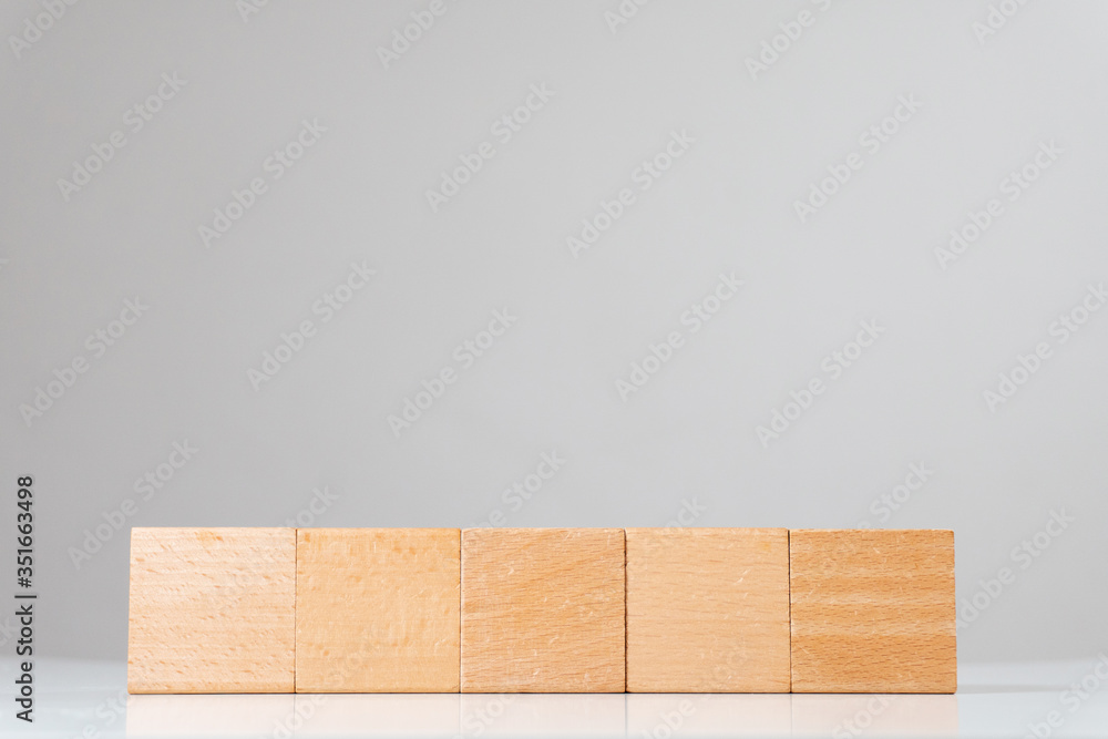 Wooden square cube figures in line isolated Wooden square cube figures in line isolated