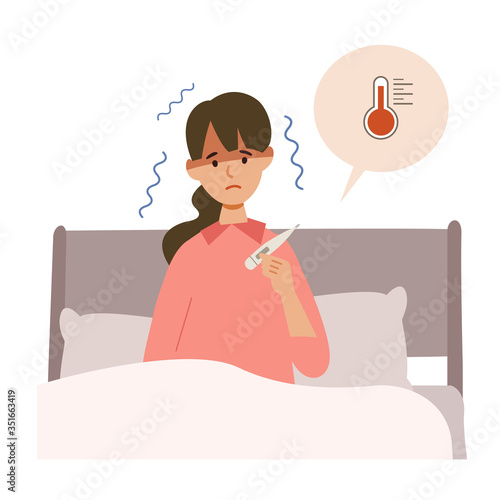 【新しい生活様式】体調不良で体温計で検温する女性