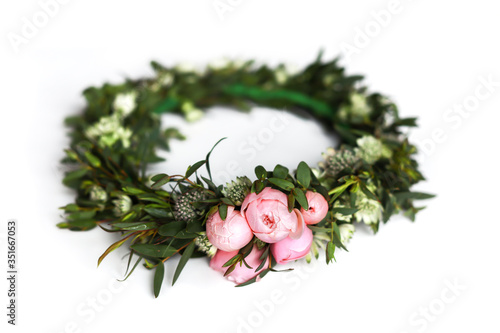 Flower whreath with green leaves and tender pink roses on isolated white background