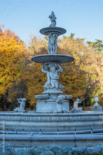 antique stone ornamental fountain in a public park in Madrid. Spain