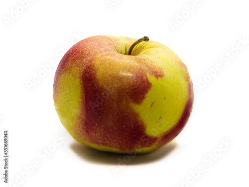 Red apple with green stripes on the white background isolated