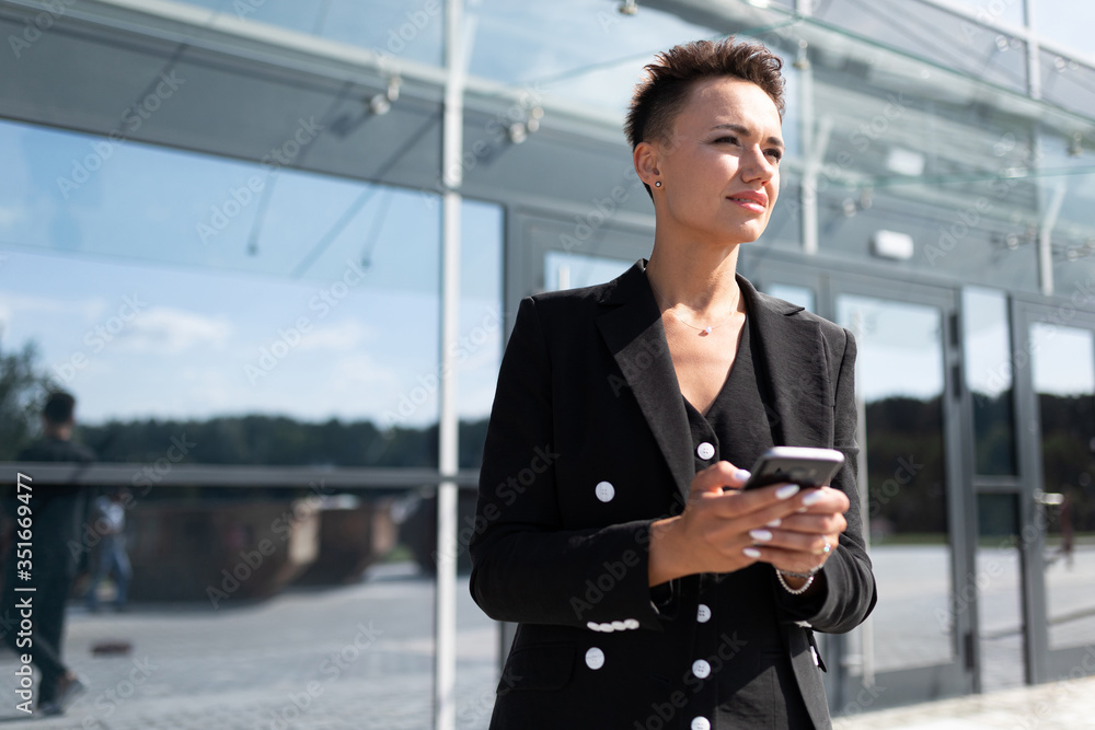 Female in office suit made an appointment and is waiting for colleague Female in office suit made an appointment and is waiting for colleague