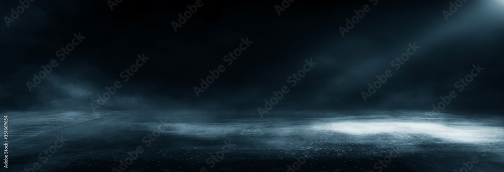 Wet asphalt, reflection of neon lights, a searchlight, smoke. Abstract light in a dark empty street with smoke, smog. Dark background scene of empty street, night view, night city.