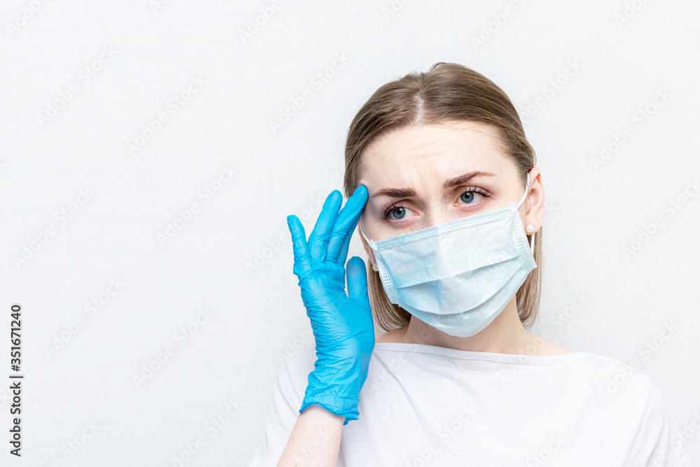 Doctor got sick with coronavirus, woman in a medical mask is not feeling well, white background, copy space Doctor got sick with coronavirus, woman in a medical mask is not feeling well, white background, copy space