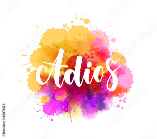 Adios ( Goodbye in Spanish) - handwritten calligraphy lettering on colorful abstract watercolor background. photo