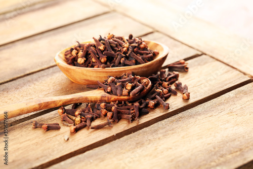 freshly dryed cloves spice texture on background