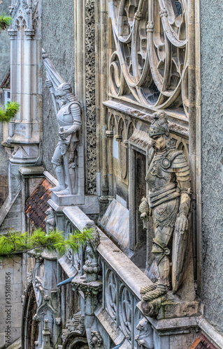 Stone gargoyles and statues of knights in armor. Medieval scenery of Vajdahunyad Castle in Varoshliget Park in Budapest, Hungary photo