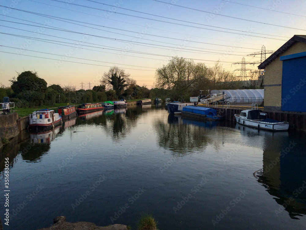 Boats on the River Lee Navigation in Enfield, London, United Kingdom Boats on the River Lee Navigation in Enfield, London, United Kingdom