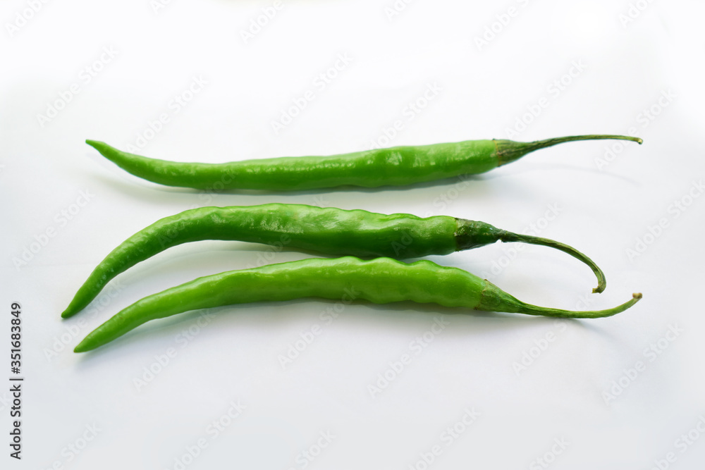 fresh Green chili on white background,Indian spicy chili. fresh Green chili on white background,Indian spicy chili.