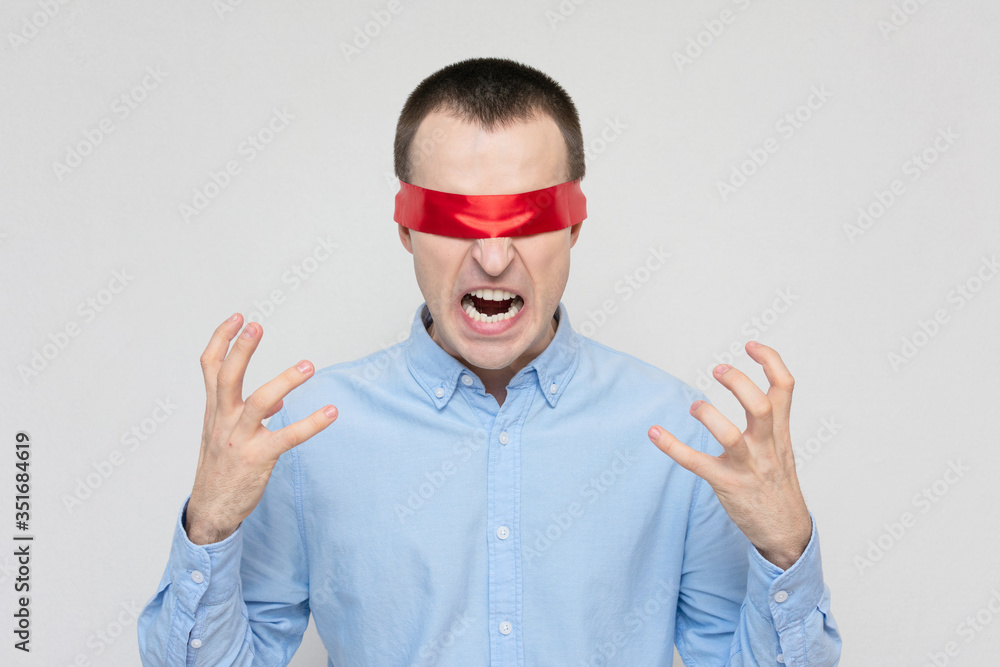 Angry man with a blindfold shouting, red blindfold, portrait, white background, copy space Angry man with a blindfold shouting, red blindfold, portrait, white background, copy space
