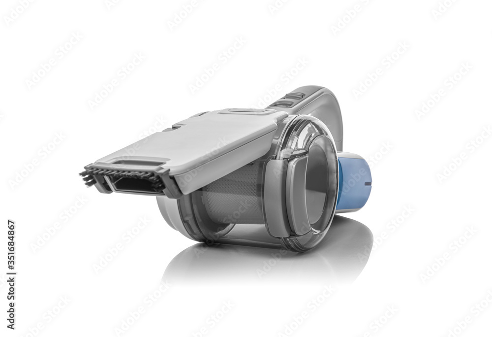 A handheld portable lithium battery vacuum cleaner is isolated on a white background. A handheld portable lithium battery vacuum cleaner is isolated on a white background.