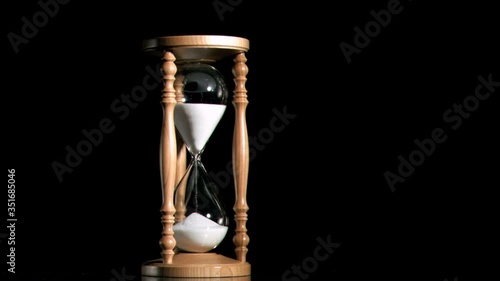 Old hourglass in super slow motion photo