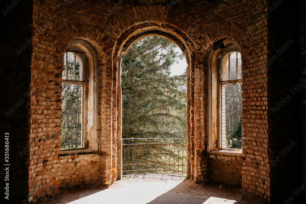 Fototapeta premium old brick destroyed building. Ruined walls and windows