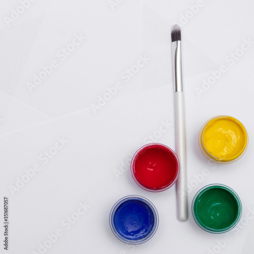 Wallpaper Mural Cans of different colors gouache paints and artist brush, white background, copy space, 1:1 Torontodigital.ca