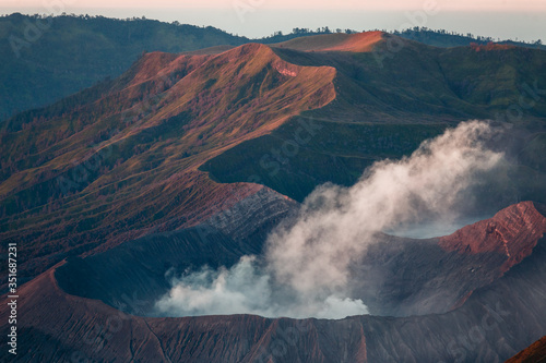Bromo volcano on Java island, Indonesia. Foggy sunrise, another planet landscape