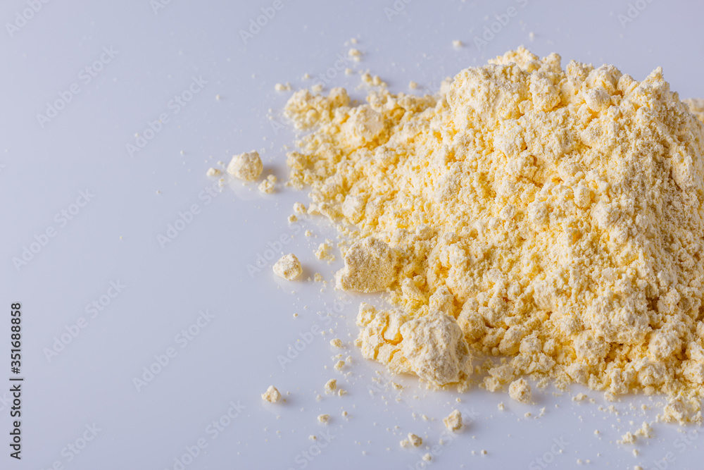 natural corn flour on white acrylic background natural corn flour on white acrylic background